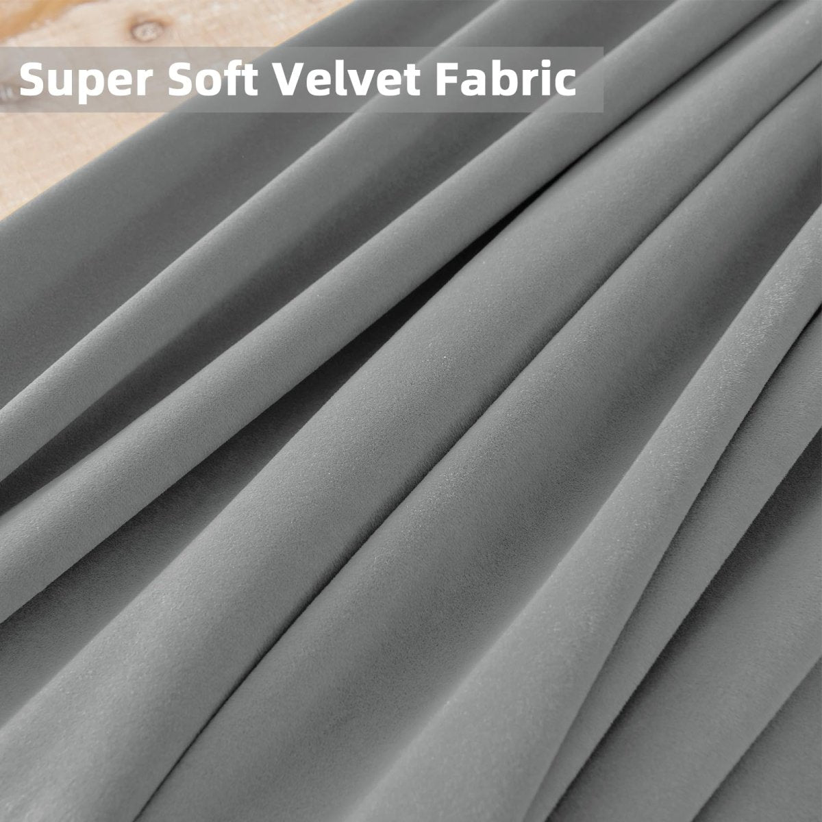 Close-up of soft grey velvet fabric showing luxurious texture and drape, ideal for blackout curtains.