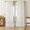 Off-white linen sheer curtains filtering light in a bright living room.