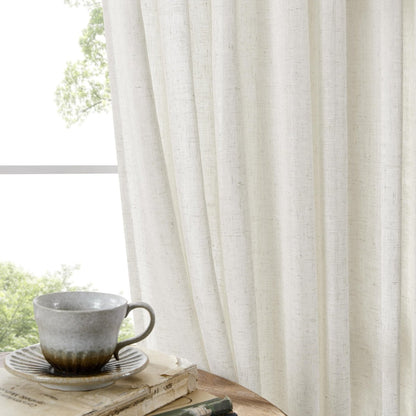 Off white linen sheer curtains in living room, filtering light, showcasing texture. Cozy atmosphere.