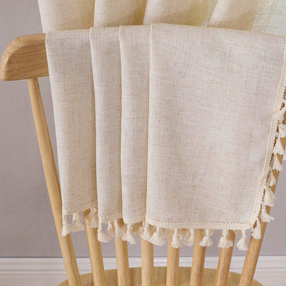 Close-up of Joydeco beige linen curtains featuring natural texture and tassel trim detail.
