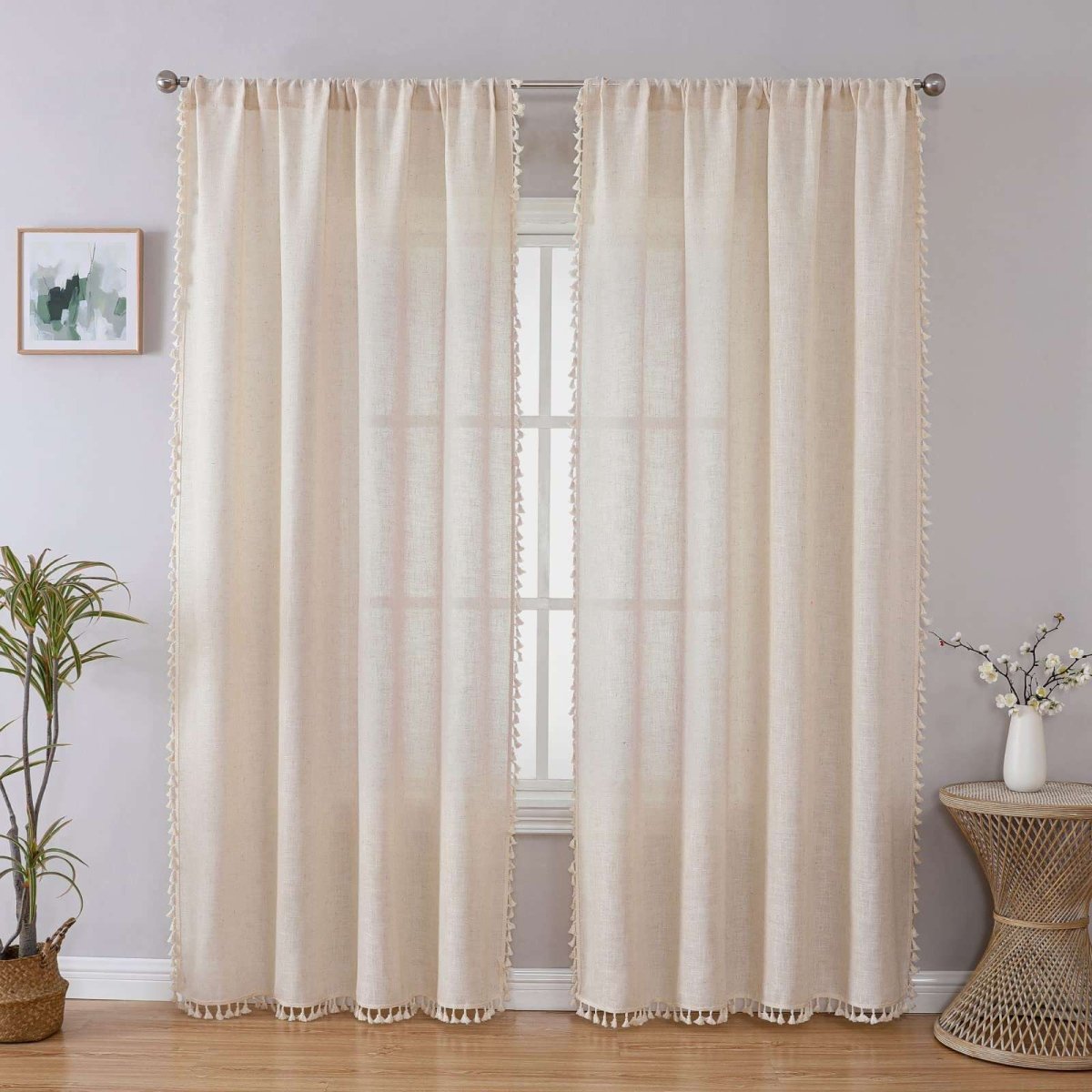 Joydeco beige boho linen curtains with tassel trim and embroidery, displayed in a room setting.