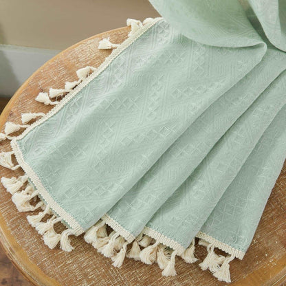 Mint green boho linen sheer curtain texture with diamond embroidery and cream tassel trim.