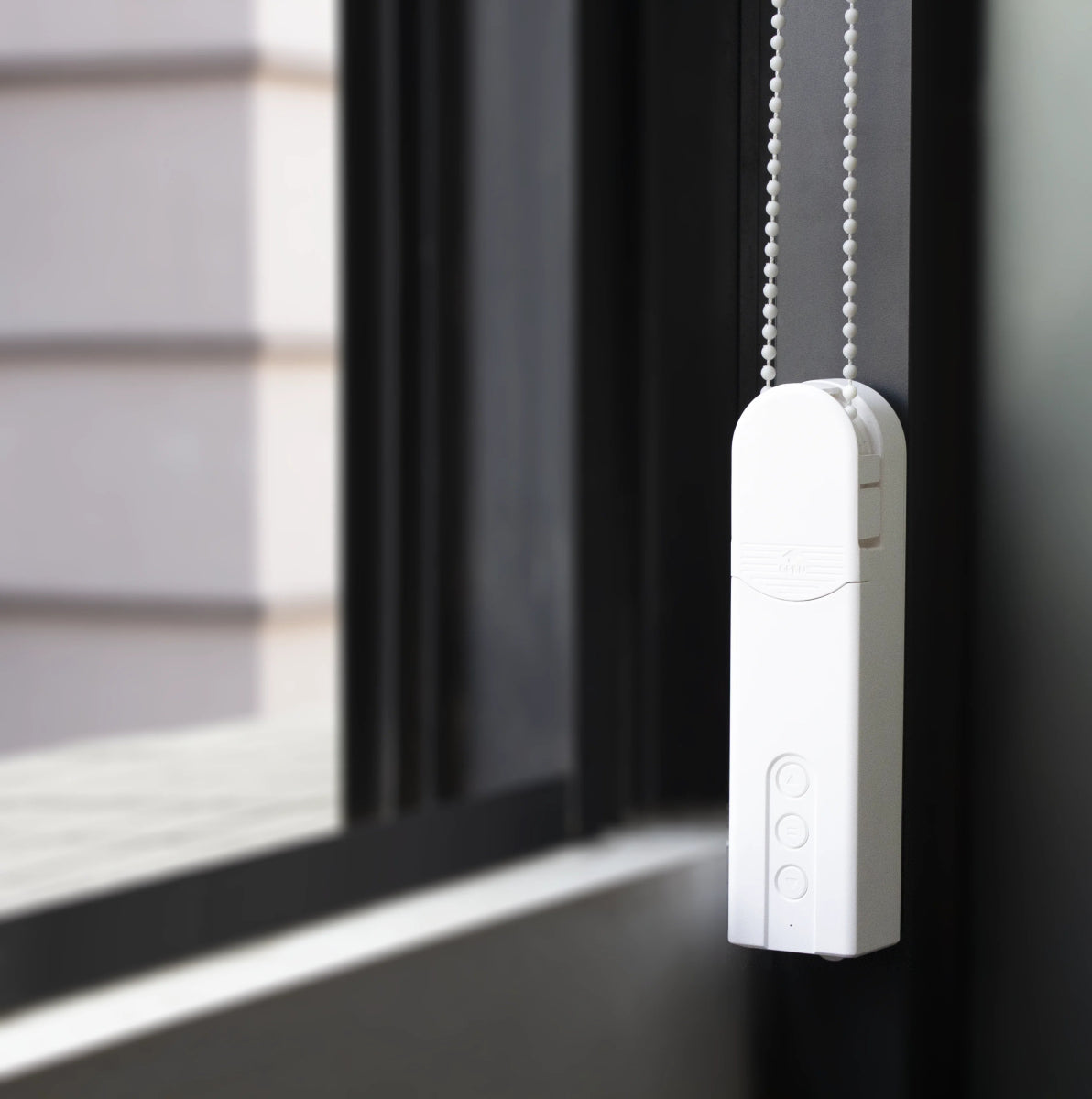 White Joydeco smart chain roller blind motor attached to window frame, with three control buttons.