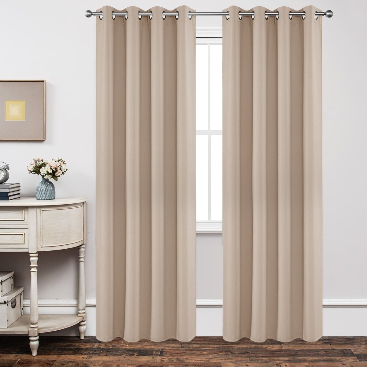 Light beige blackout curtains, grommet top, thick fabric, pleated, in a bedroom.