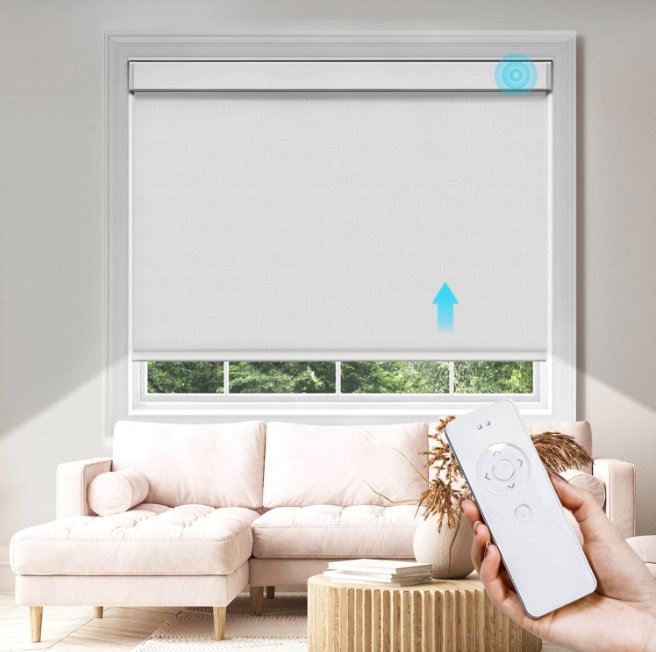 White motorized roller blind with remote control, demonstrating ease of use with an upward arrow graphic.