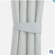 Light blue and white pinstripe curtain tieback holding gathered curtains open on a product page.