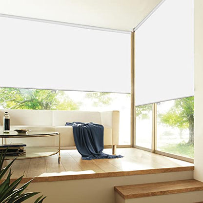 White cordless blackout roller blinds in modern living room with sofa.