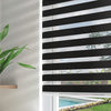 Black and white Joydeco sheer zebra blinds partially open on a living room window, filtering light and showing a pool view.